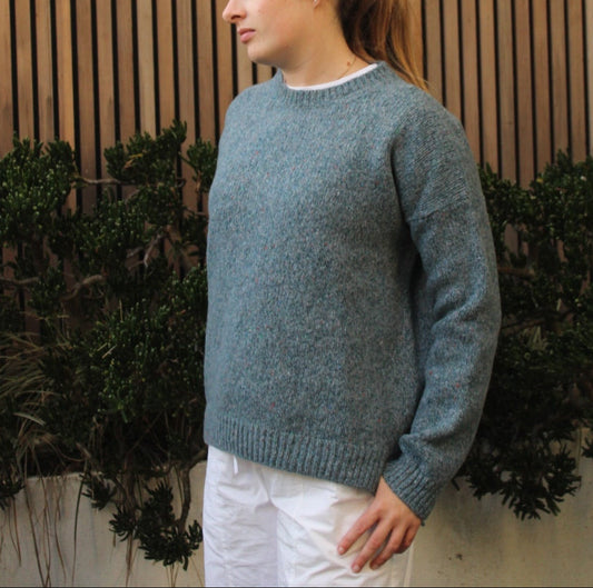 Woman wearing the Fisherman out of Ireland Dropped Shoulder Crew Jumper in blue smoke