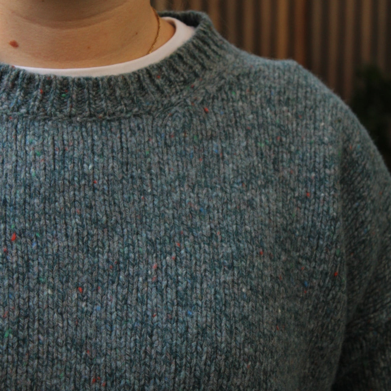 Woman wearing the Fisherman out of Ireland Dropped Shoulder Crew Jumper in blue smoke
