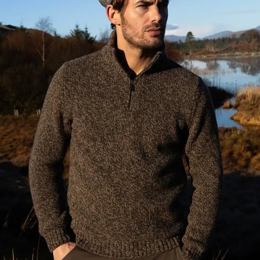 Man wearing the Fisherman out of ireland quarter zip sweater in peat brown