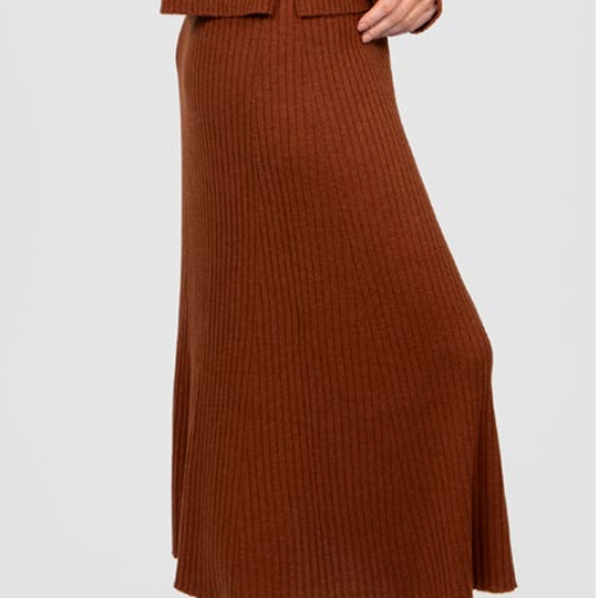 Woman wearing the Flared Skirt in Cognac by Bridge and Lord