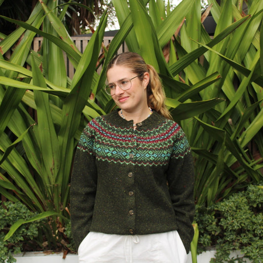 Woman wearing the Chunky wool nep Fairisle Cardigan by Harley of Scotland in Harris green