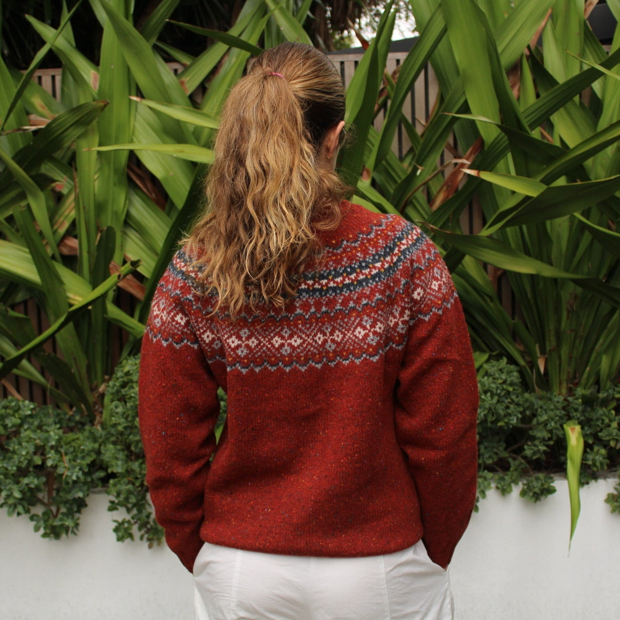 Back view of the Chunky Fairisle Nep wool Cardigan in Hoy red by Harley of Scotland