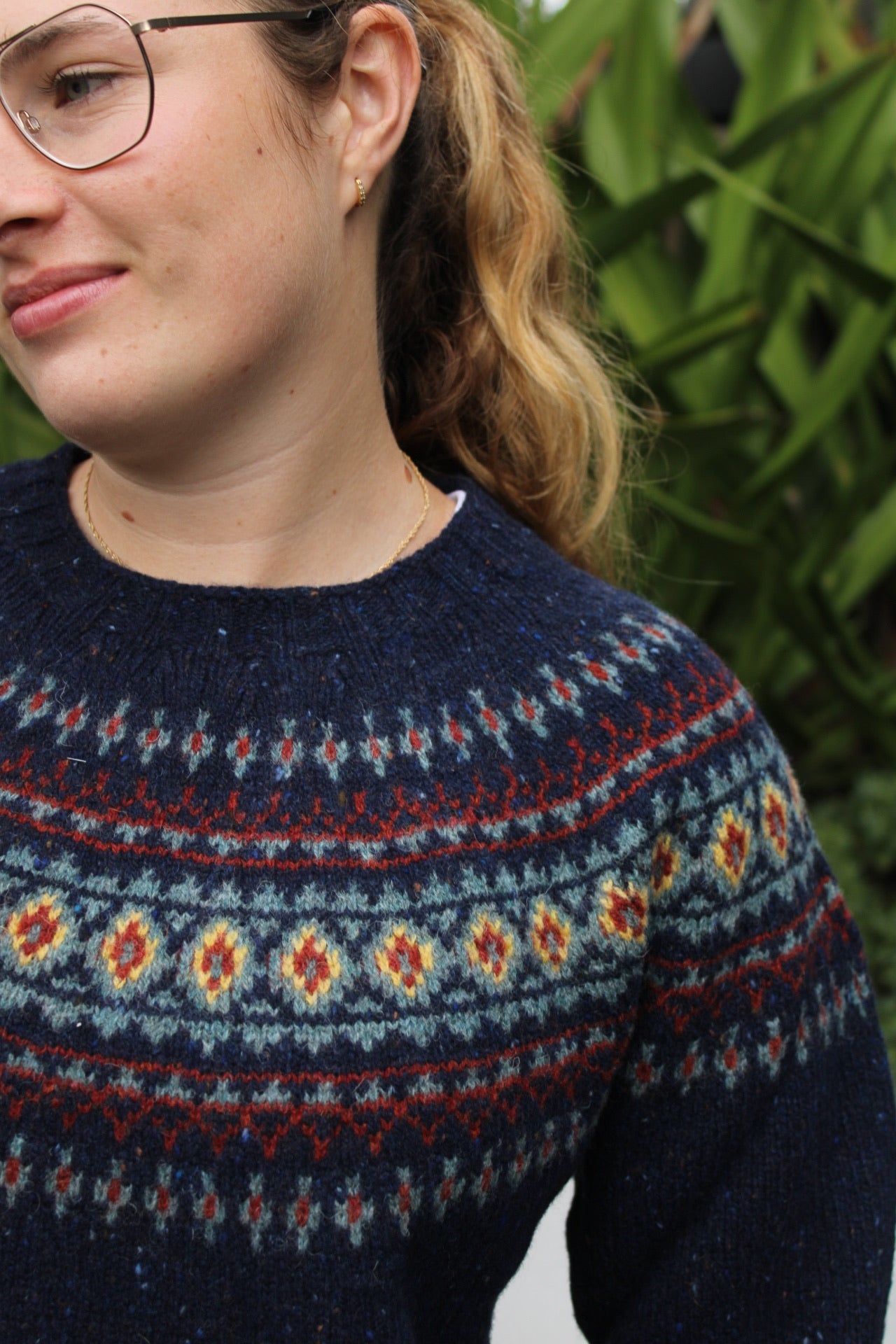 Woman wearing the wool nep Fairisle Jumper by Harley of Scotland in Jura blue