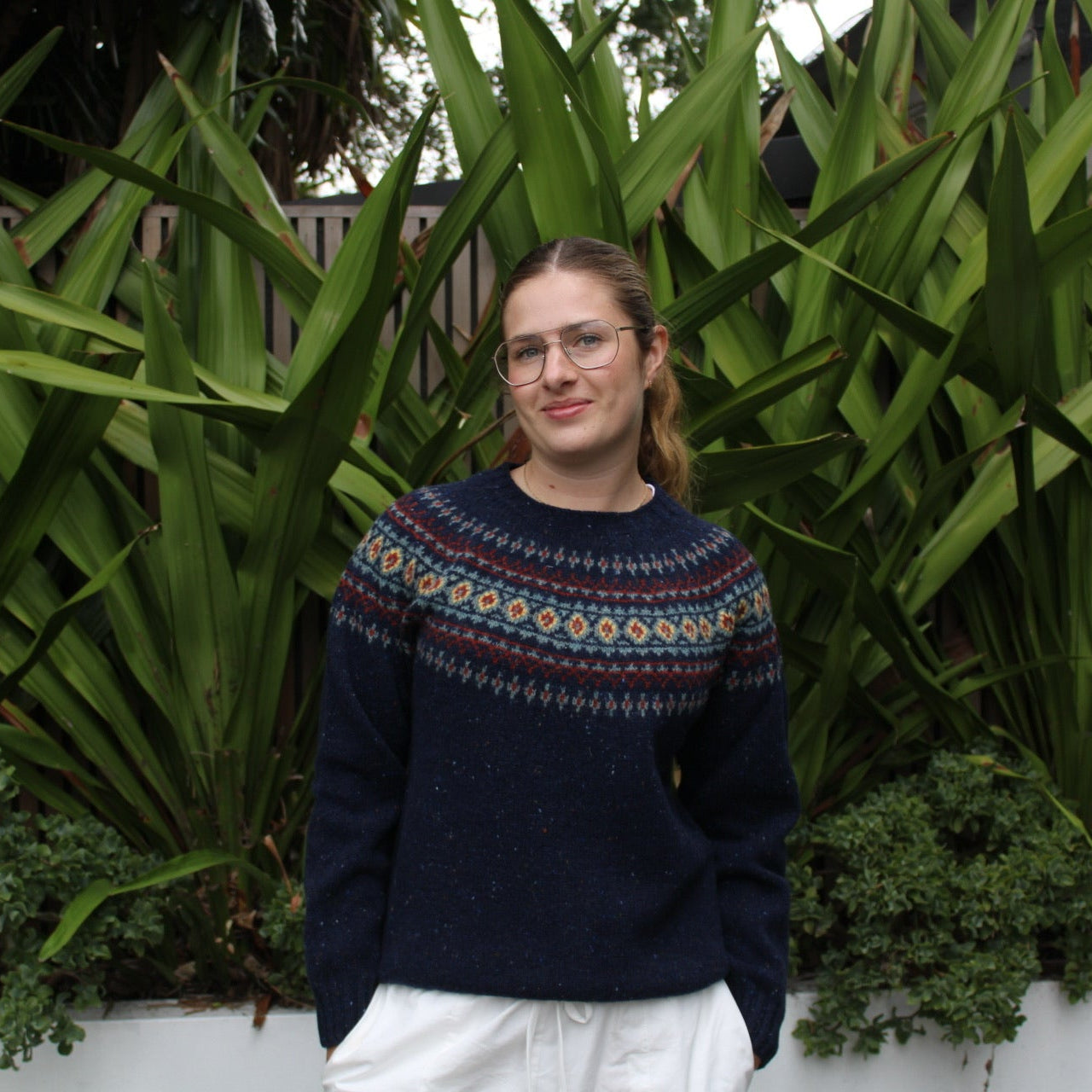 Woman wearing the wool nep Fairisle Jumper by Harley of Scotland in Jura blue