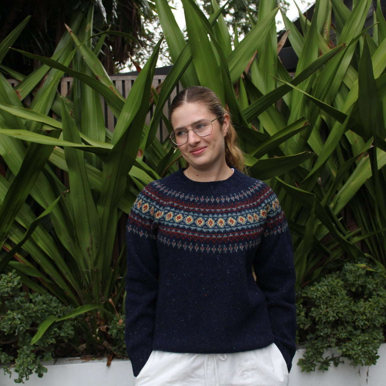 Woman wearing the wool nep Fairisle Jumper by Harley of Scotland in Jura blue