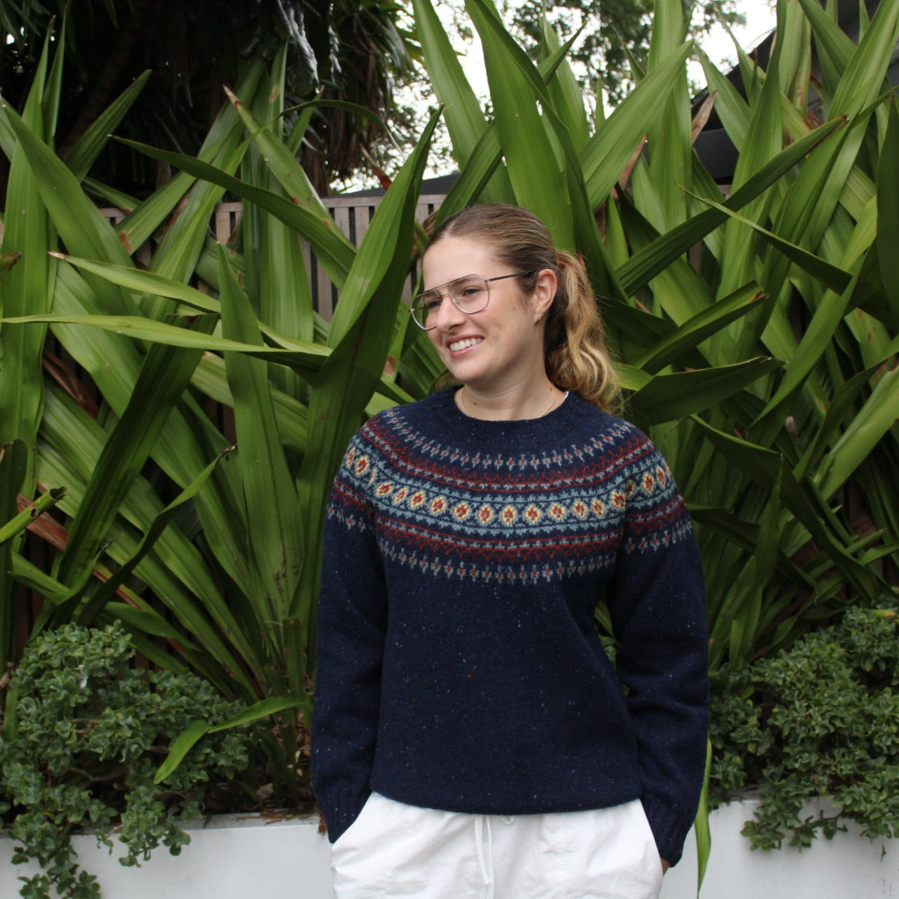 Woman wearing the wool nep Fairisle Jumper by Harley of Scotland in Jura blue