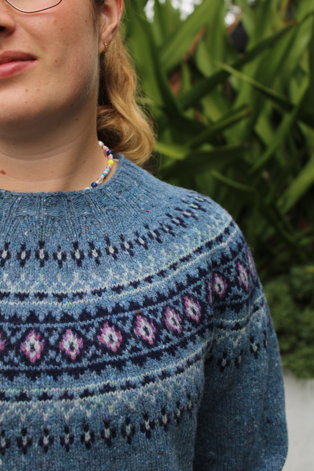 Close up of blue Fairisle knitted pattern yoke