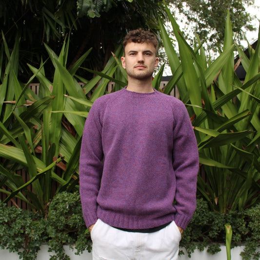 Man wearing the Chunky Crew neck wool Jumper in Calluna purple
