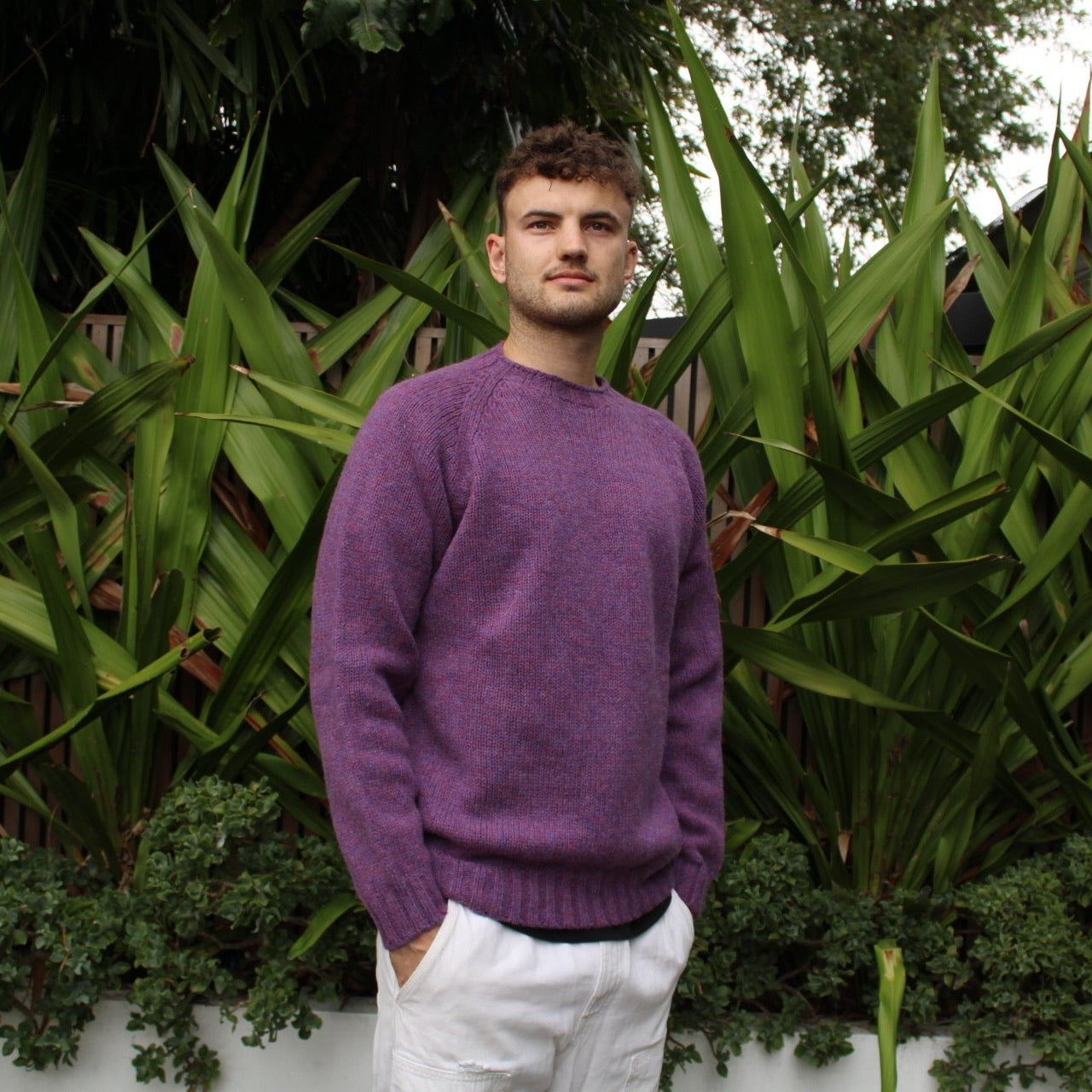 Man wearing the Chunky Crew neck wool Jumper in Calluna purple