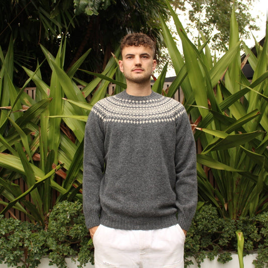Man wearing the Two Tone wool Fairisle Jumper in Basalt and white by Harley of Scotland