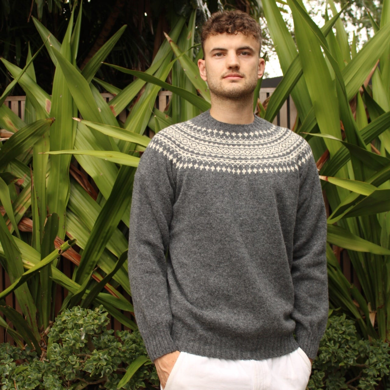Man wearing the Two Tone wool Fairisle Jumper in Basalt and white by Harley of Scotland