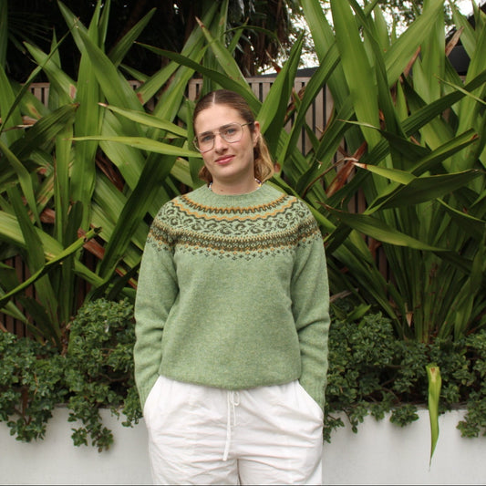 Woman wearing the Harley of Scotland woollen Fairisle Jumper in Sage green