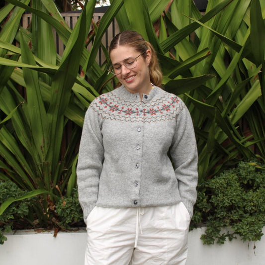 Woman wearing wool Snowflake Fairisle Cardigan in Silver by Harley of Scotland