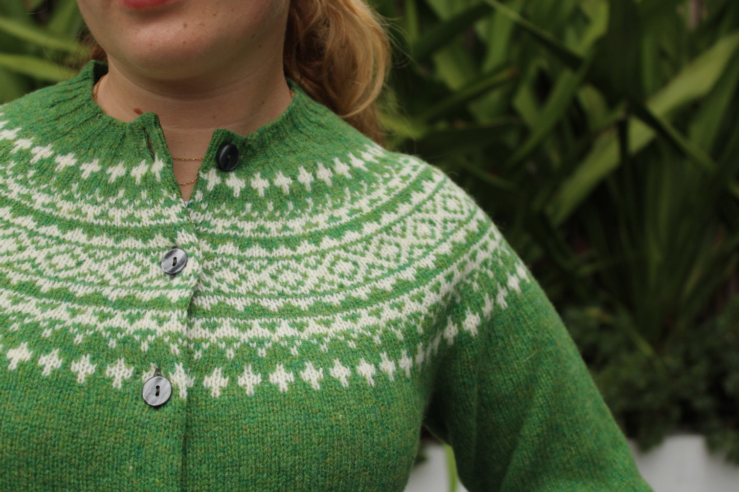 Close up of wool knitted fairisle pattern on yoke of cardigan
