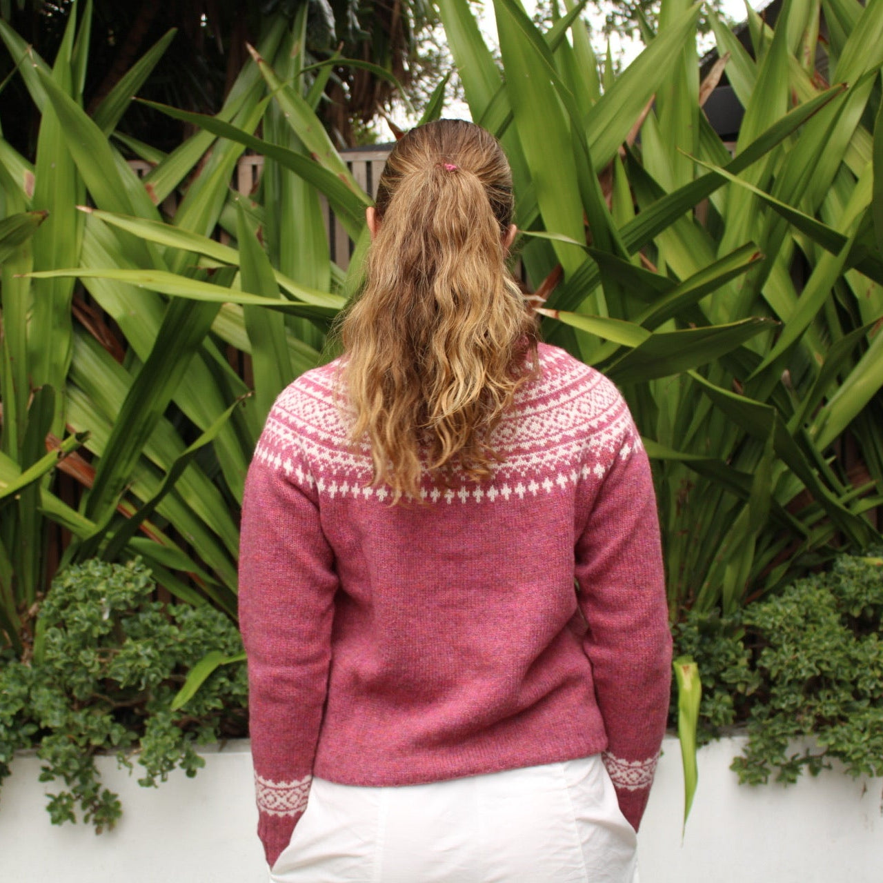 Back view of the Two Tone wool Fairisle Cardigan in Zinnia pink and white by Harley of Scotland