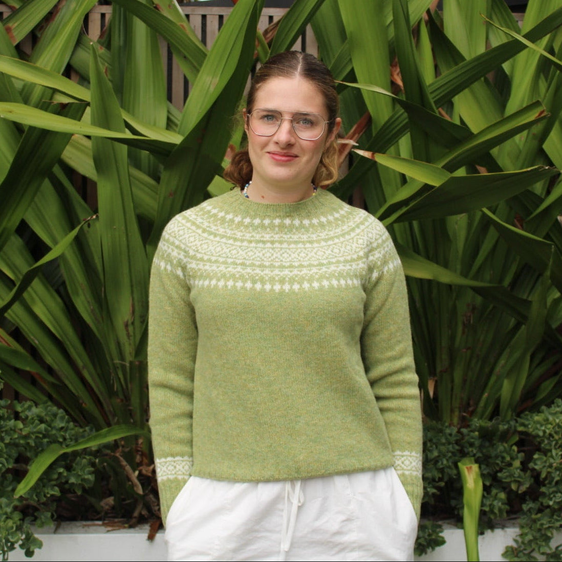 Woman wearing the Harley of Scotland Two Tone Fairisle Jumper in Avocado and white