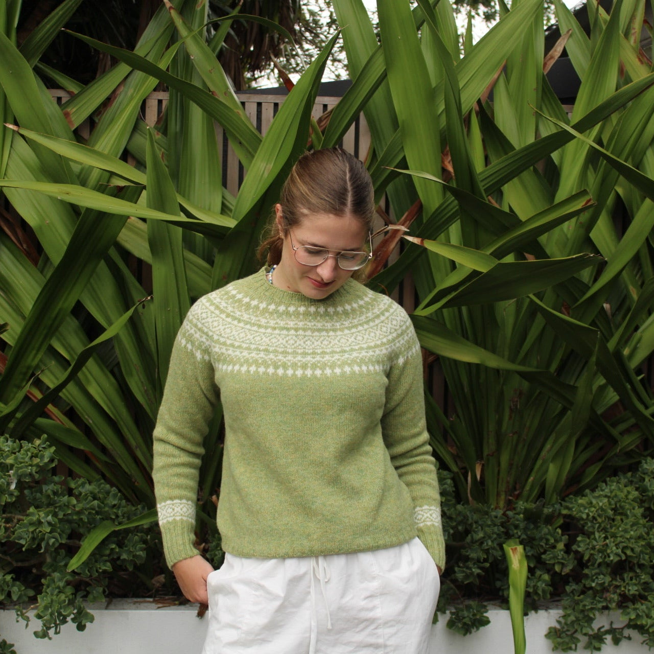 Woman wearing the Harley of Scotland Two Tone Fairisle Jumper in Avocado and white
