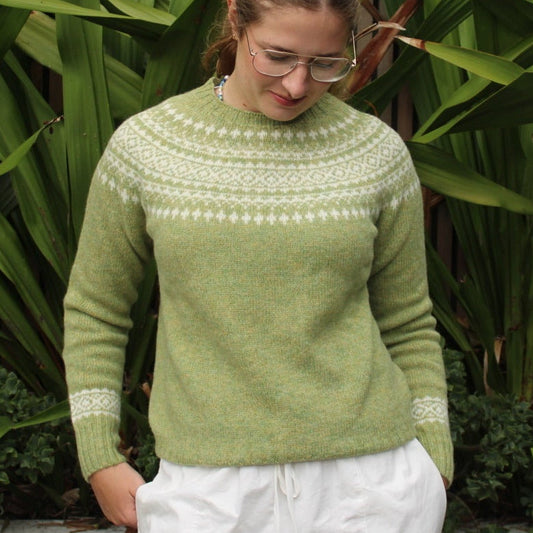 Woman wearing the Harley of Scotland Two Tone Fairisle Jumper in Avocado and white