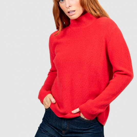 Woman wearing the High Crew Rib Jumper in Cayenne red by Bridge and Lord