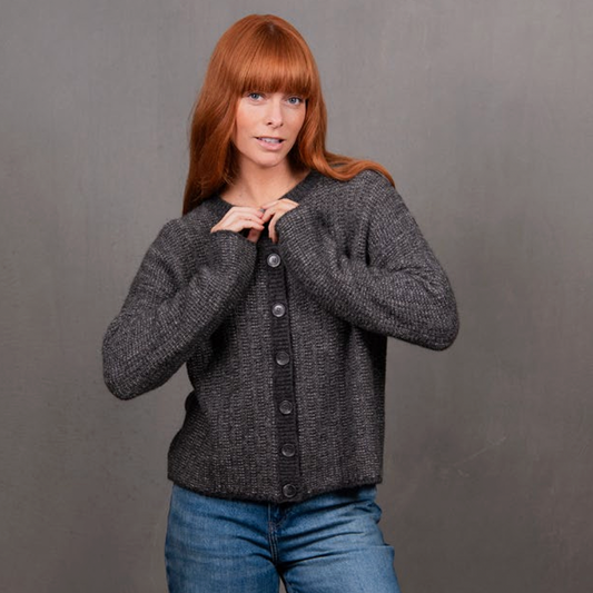 Woman wearing the Links Stripe Cardigan in grey by Bridge and Lord