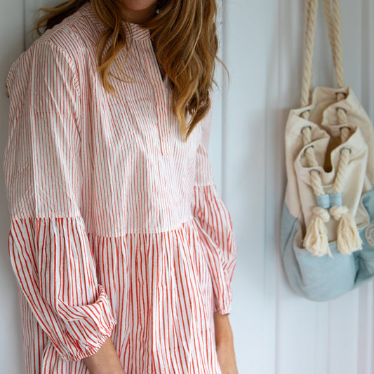 Woman wearing the Lee maxi cotton dress in tomato red by Mandalay Designs