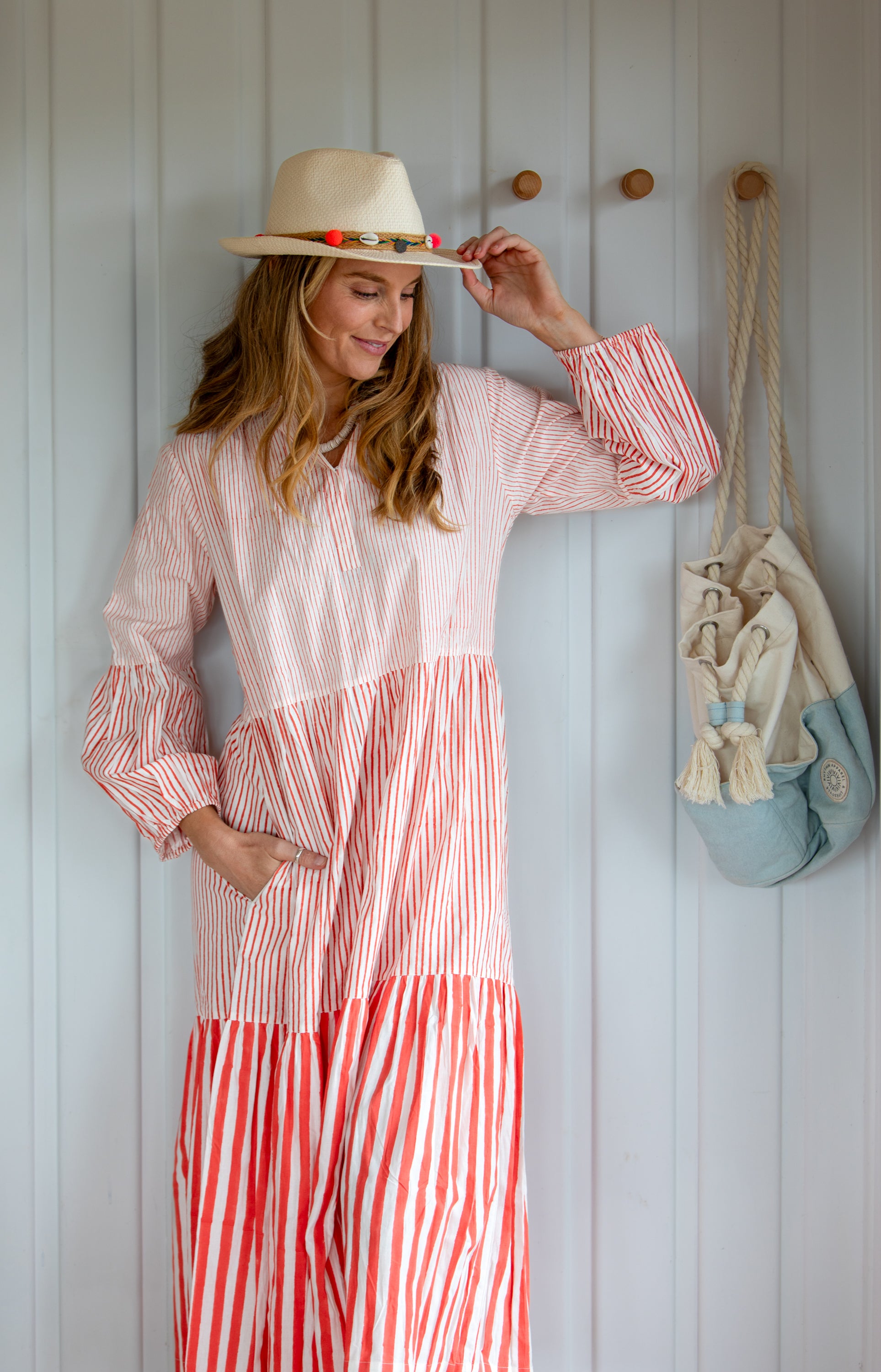 Woman wearing the Lee maxi cotton dress in tomato red by Mandalay Designs