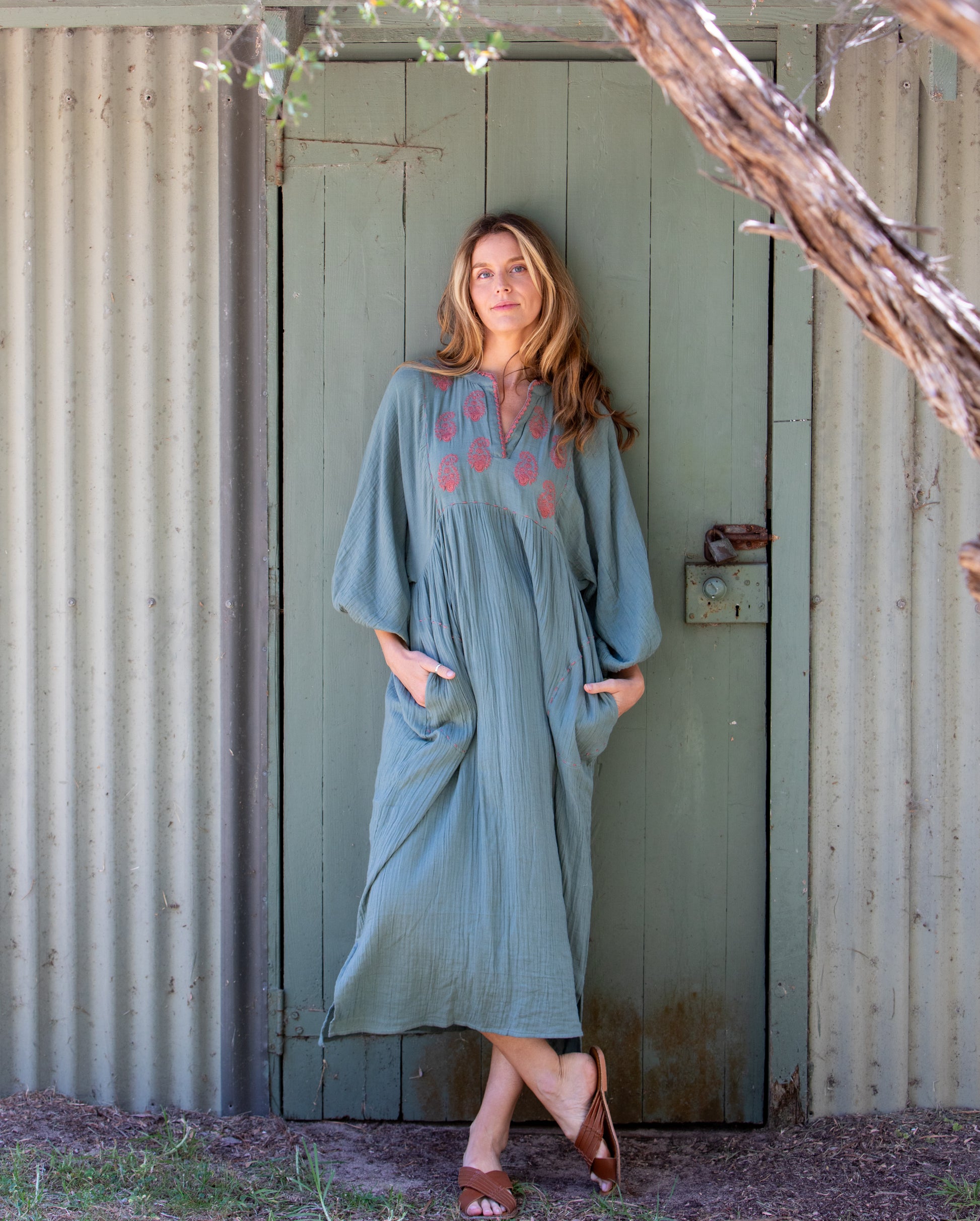 Woman wearing the Mandalay Designs Paisley Souq Dress in Wasabi