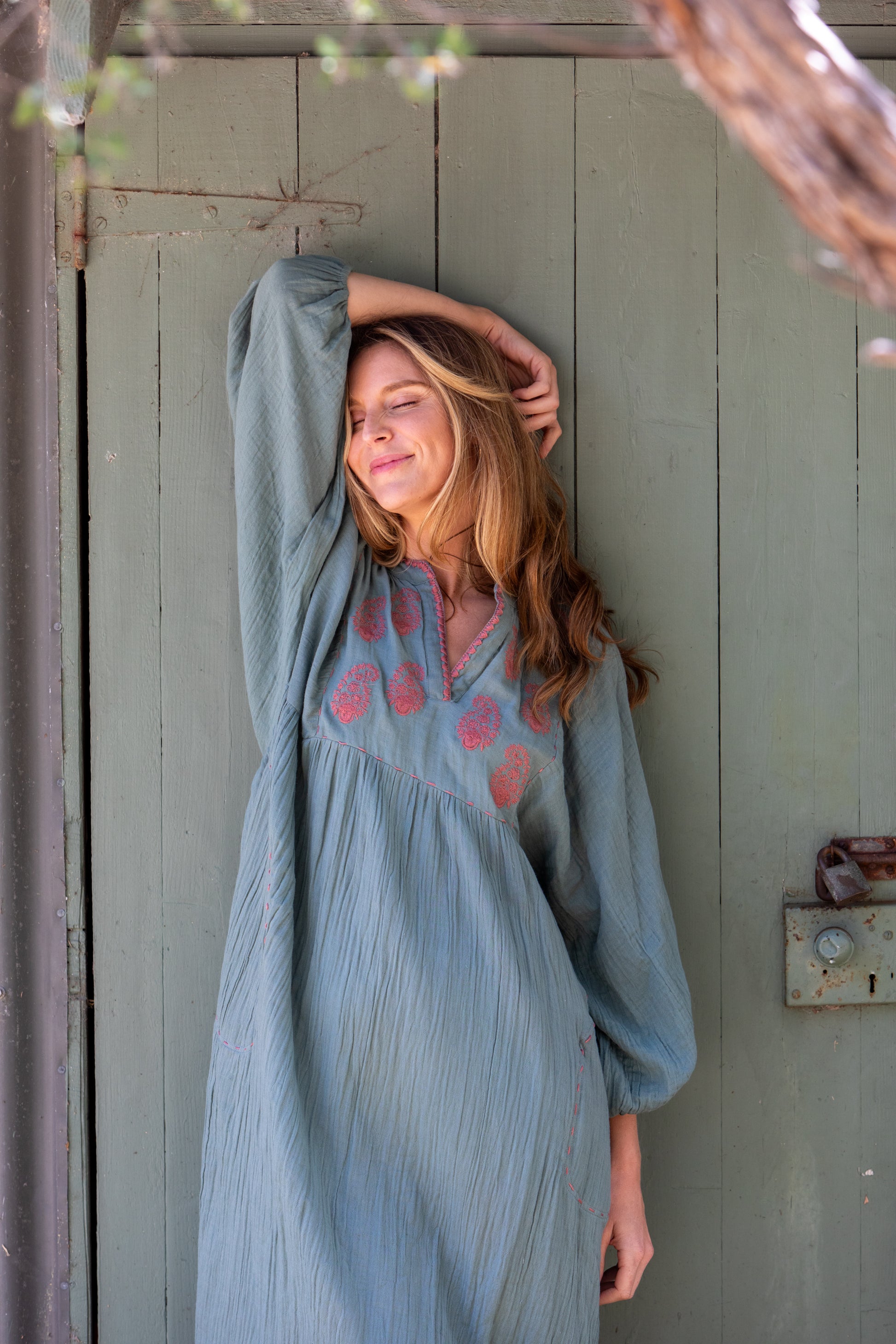 Woman wearing the Mandalay Designs Paisley Souq Dress in Wasabi by Emma Strauss
