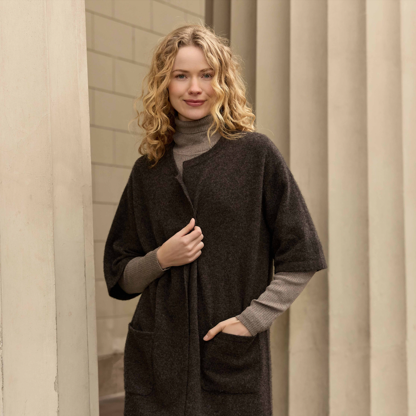 Woman wearing the Harmony wool Jacket in Dark Brown by Mansted