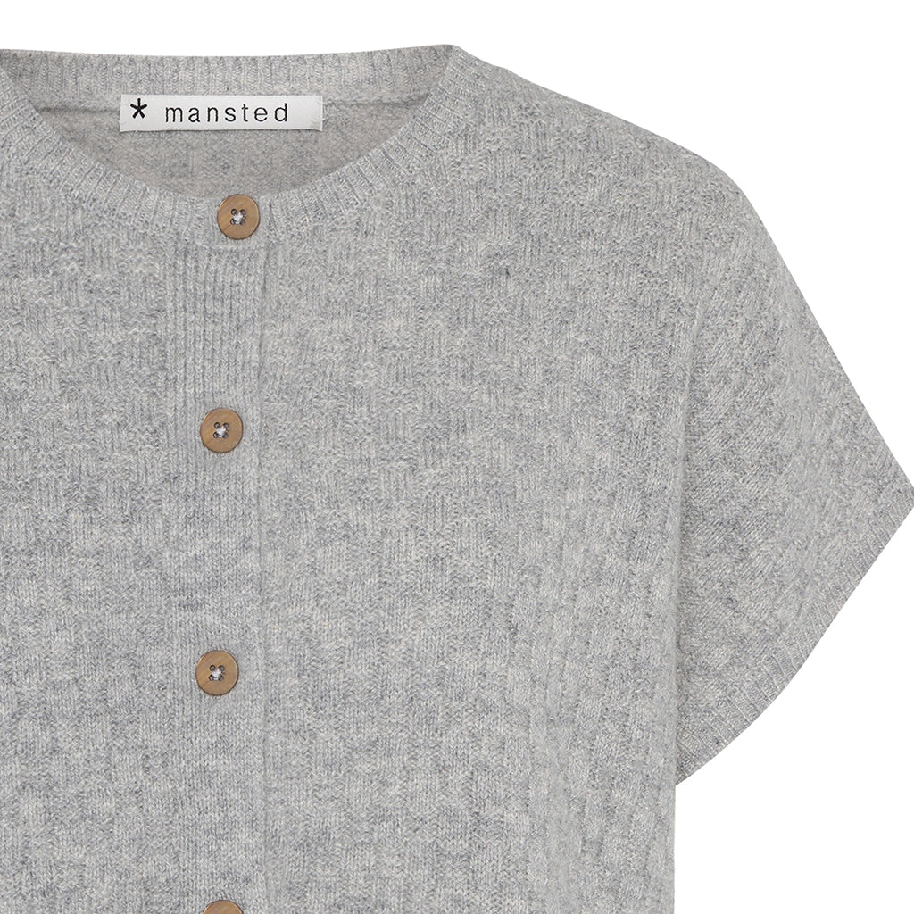 Detail of the lambswool Komma knitted vest in grey by Mansted