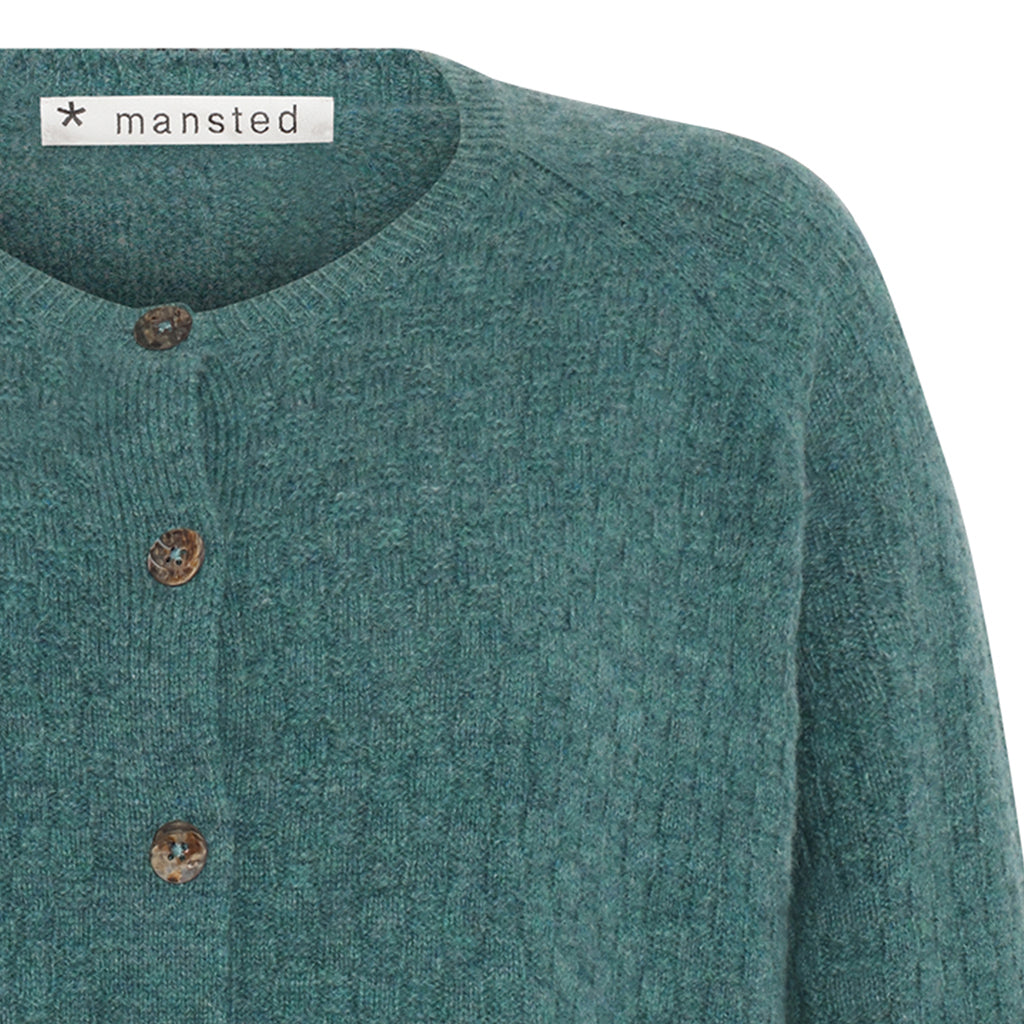 Detail of the lambswool Korinne Cardigan in Sea blue by Mansted