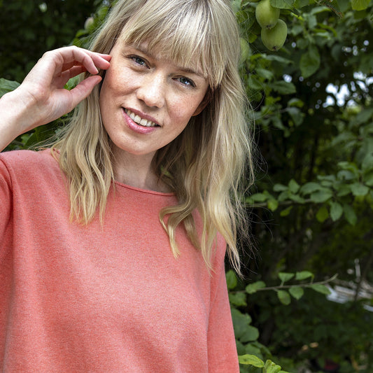 Woman wearing the NOK Oza Top in Light Red by Charlotte Mansted