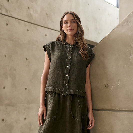 Woman wearing Naturals by O&J's Cap Sleeve linen Shirt in Licorice green