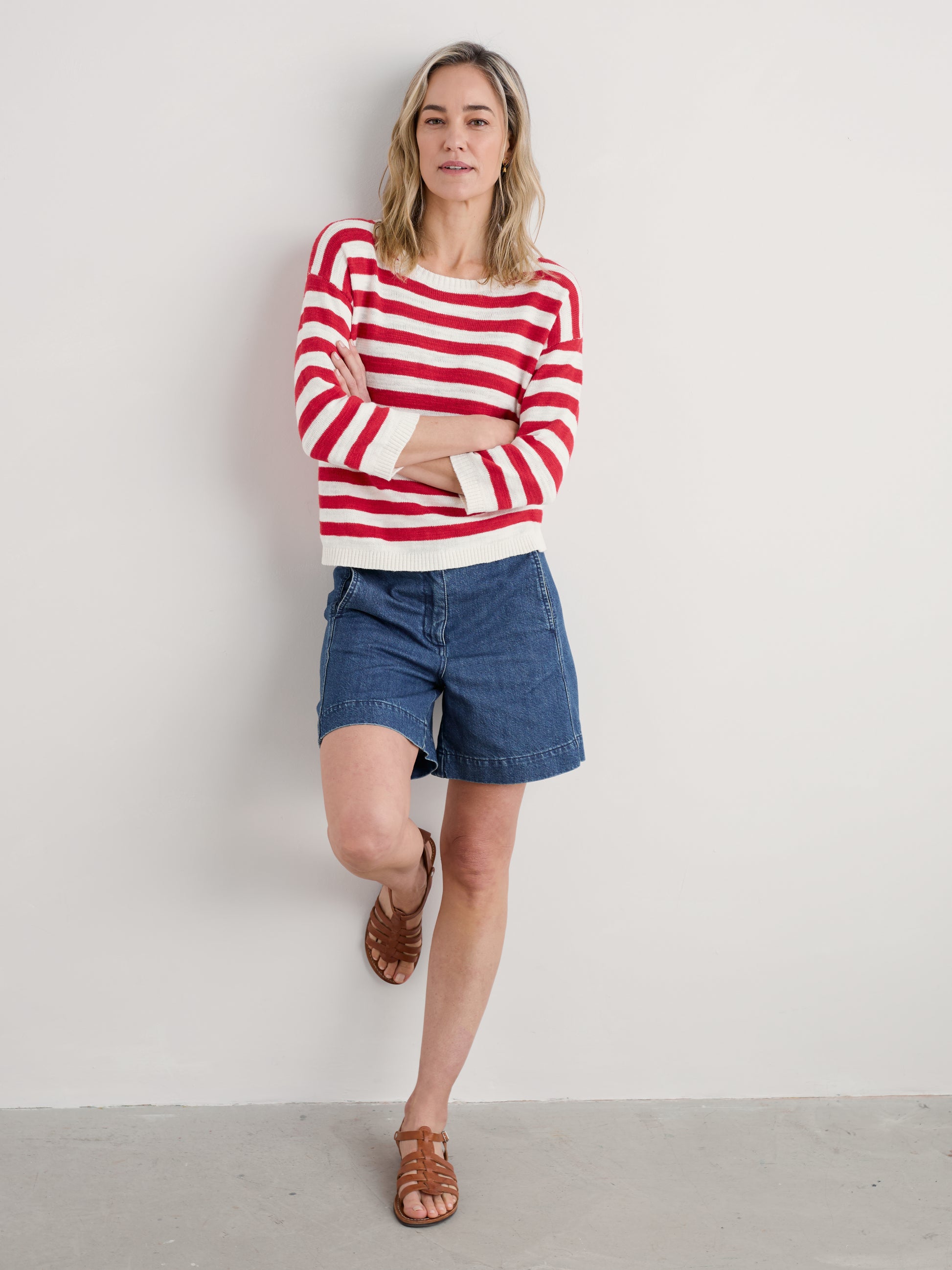 Woman wearing the Knavock Striped cotton Jumper by SEASALT in Cornish Chalk Scarlet 
