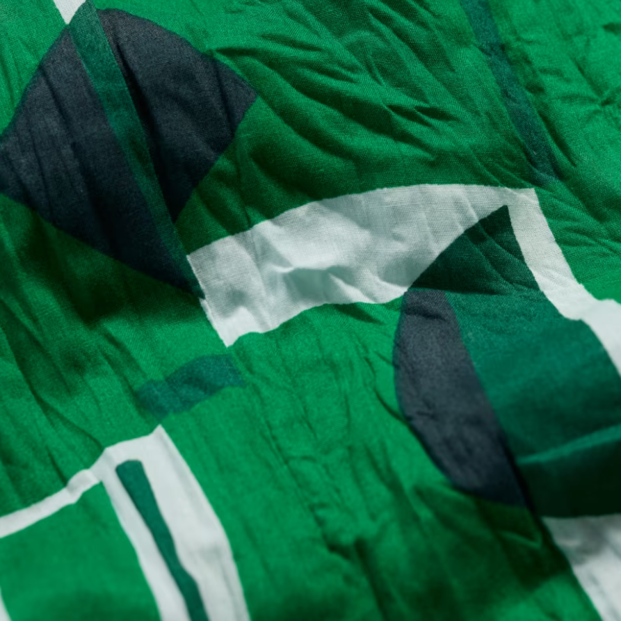 Close up of green Larissa Shirt in Paper Forms Island print
