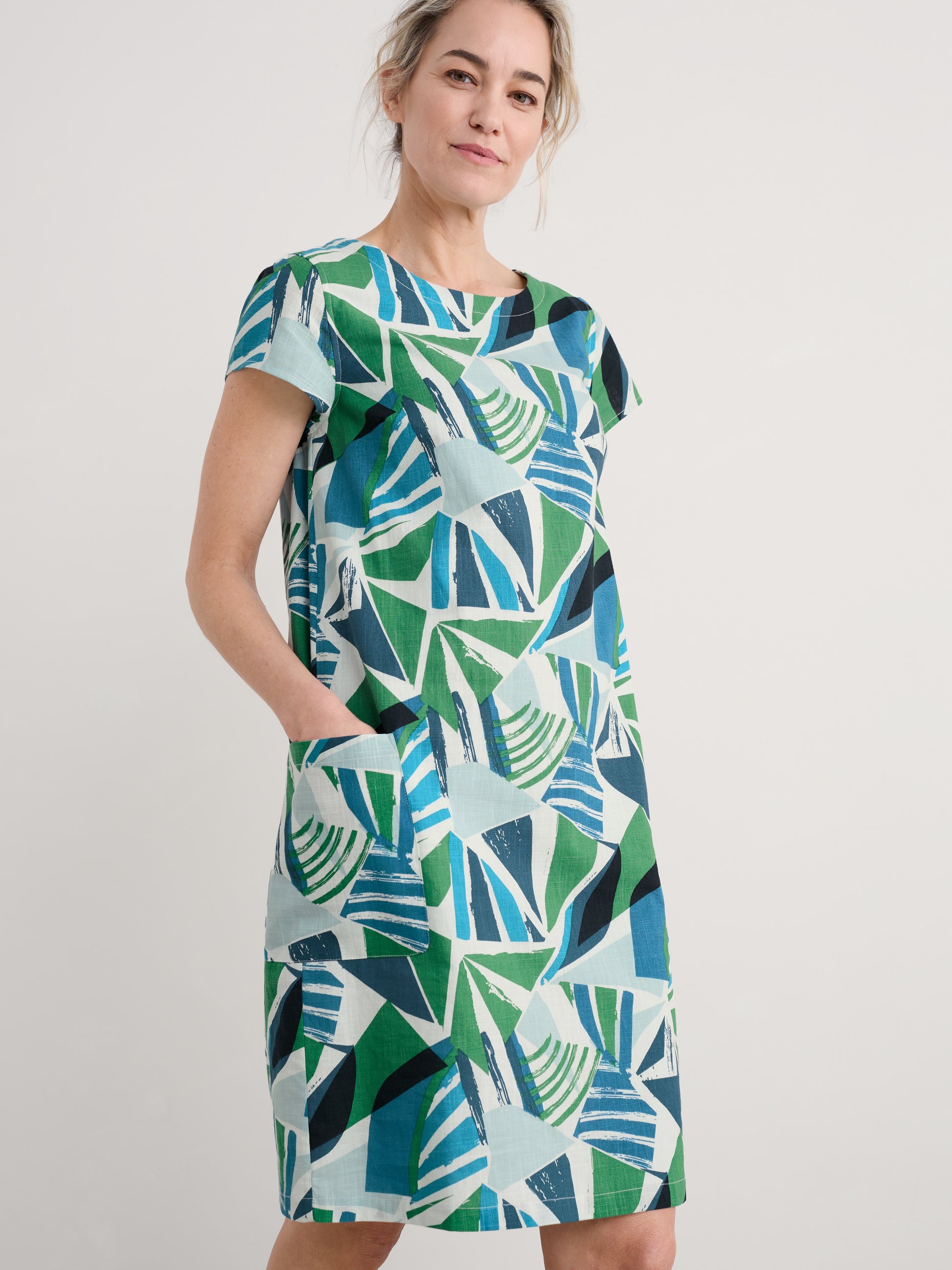 Woman wearing the River Cover cotton shift Dress by SEASALT in Spinnaker Sails Hedgerow