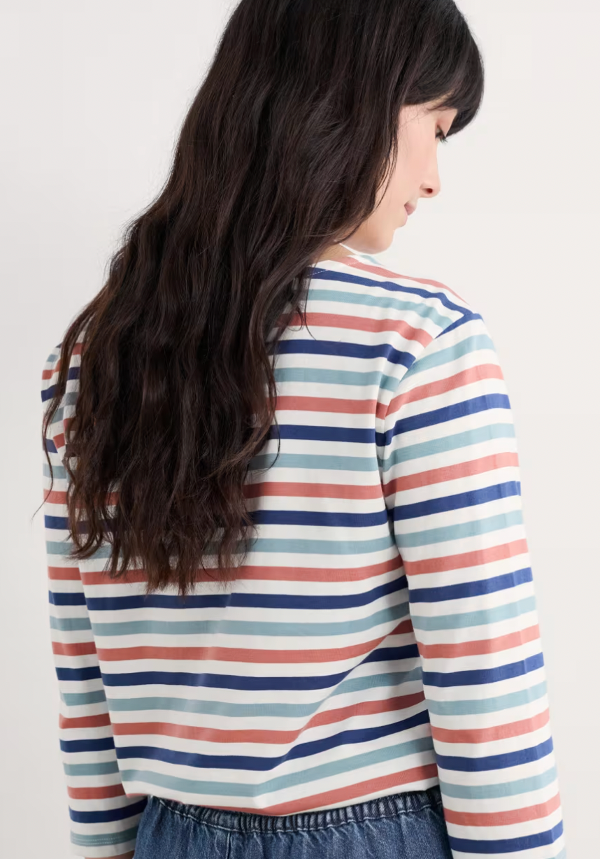Woman wearing the Sailor striped top by SEASALT in Tri Mini Cornish Chalk Rose Dew