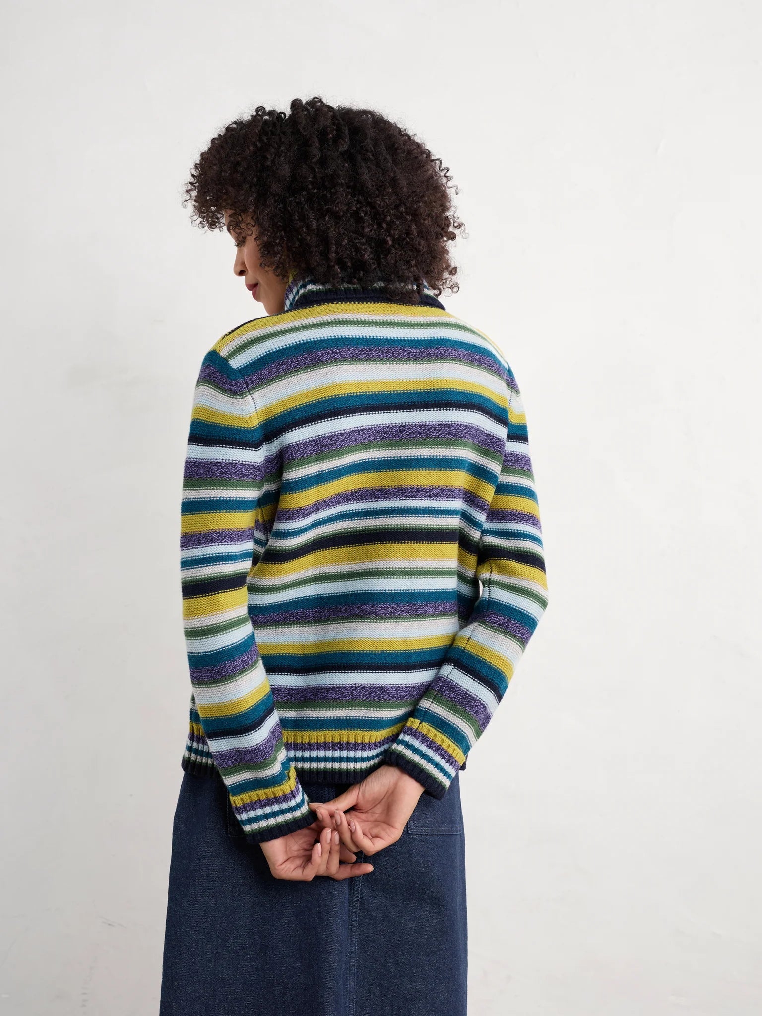 Woman wearing the Braque Striped wool Jumper in Concertina Dark Citron Multi by SEASALT