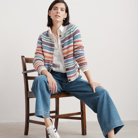 Woman wearing the Percella Cove wool cardigan by SEASALT in Abstraction Multi fair isle
