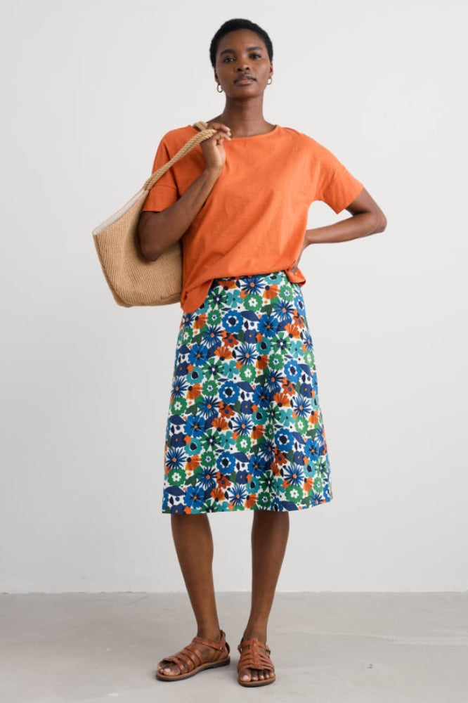 Woman wearing the Rose Skirt by SEASALT in Floral Chalk blue print