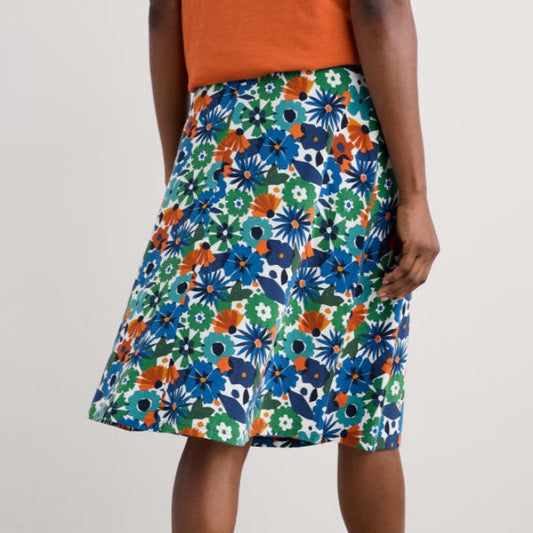 Woman wearing the Rose Skirt by SEASALT in Floral Chalk blue print