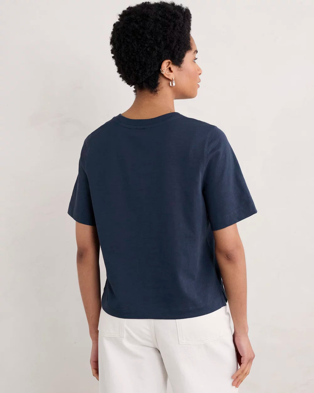 Woman wearing the cotton Copseland T-Shirt by SEASALT in Maritime navy