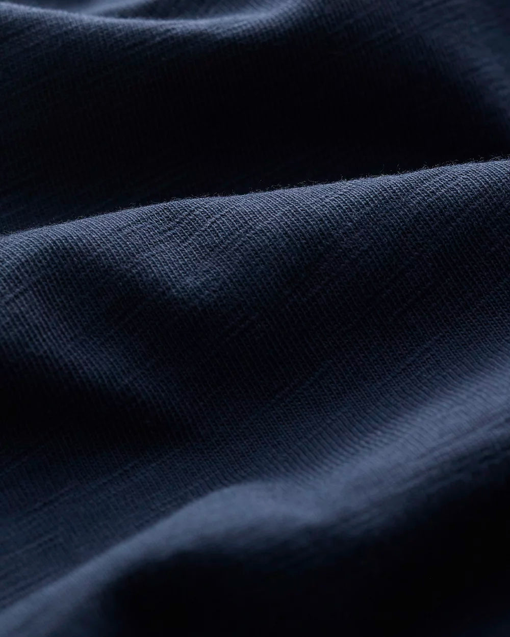Close-up of dark blue knit of the cotton Copseland T-Shirt in Maritime Navy