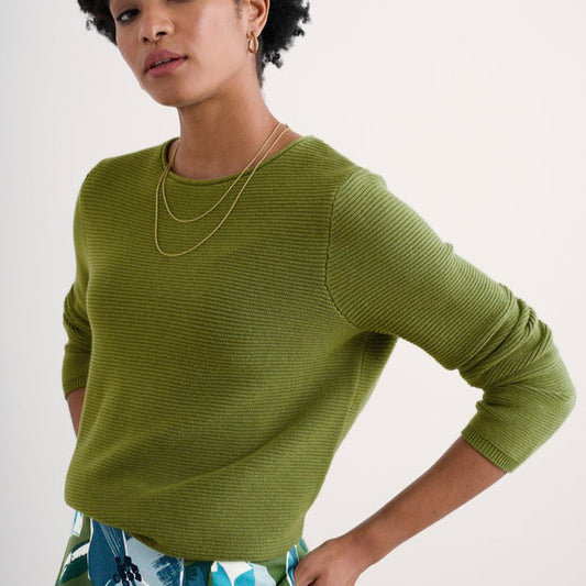 Woman wearing the Makers cotton Jumper by SEASALT in Dark Citron