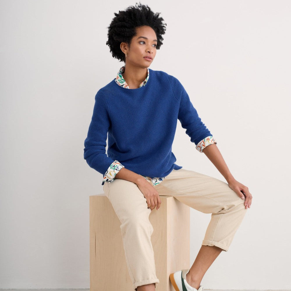 Woman wearing the Makers cotton Jumper by SEASALT in washed marine blue