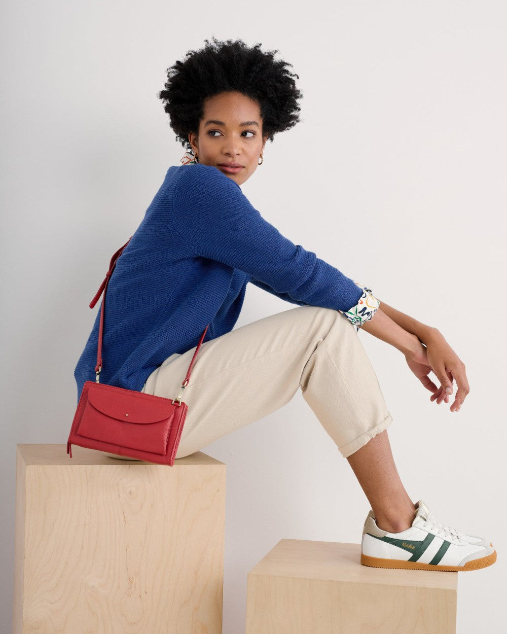 Woman wearing the Makers crew Jumper by SEASALT in washed marine blue