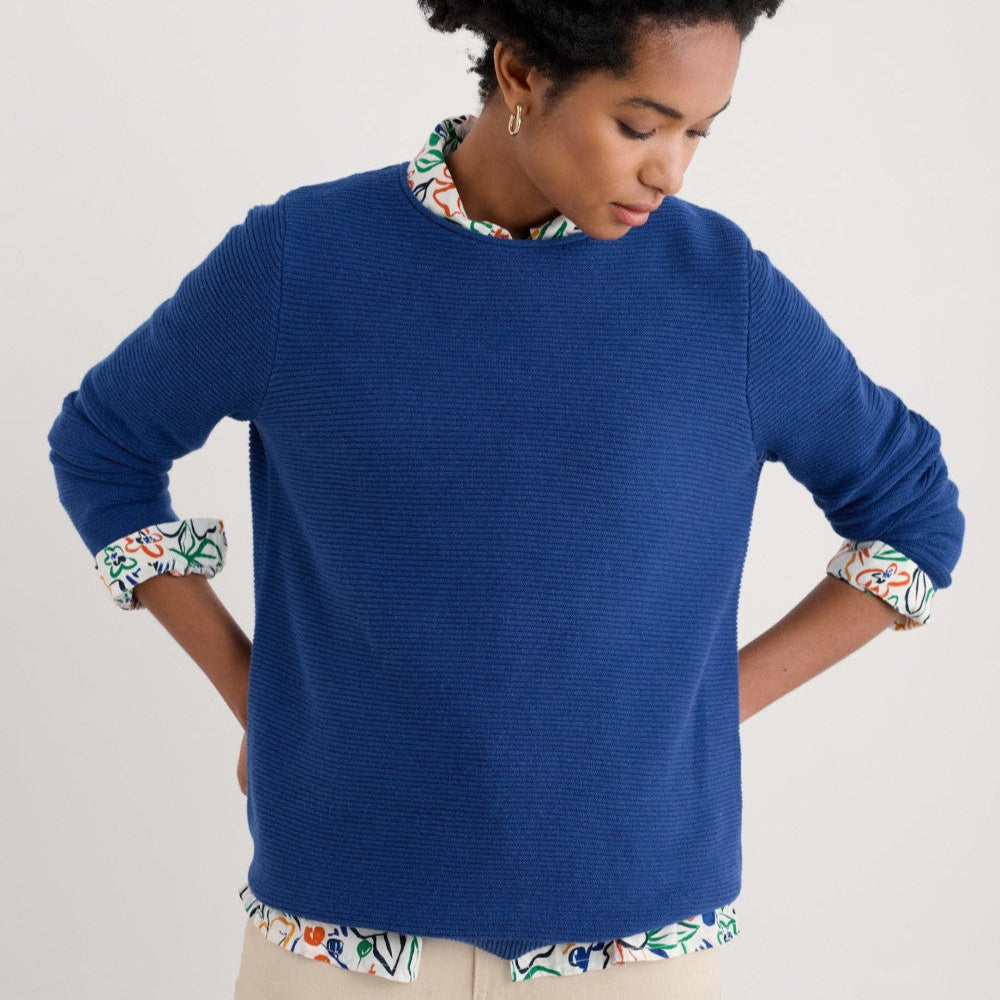 Woman wearing the Makers cotton Jumper by SEASALT in washed marine blue