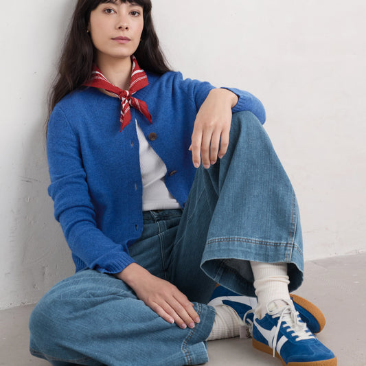 Woman wearing the Tern Tide merino wool Cardigan in Ink blue by SEASALT
