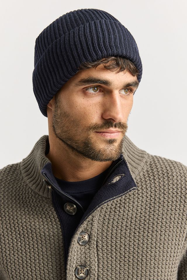Man wearing the French Navy Merino Rib Beanie by Toorallie