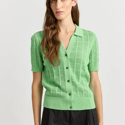 Woman wearing Toorallie's Open Stitch merino cotton knit top in Agave green